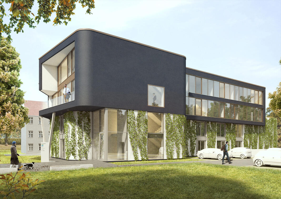 zawi-treuhand-neuburg-aussenansicht-mit-wiese-parkplatz-und-fussgaengern